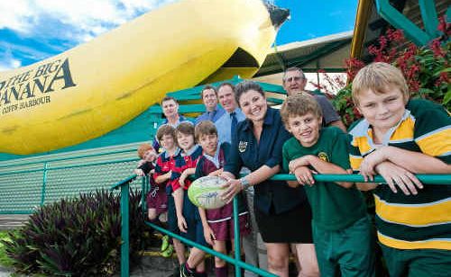 Big Banana marketing manager Erin Williams with primary school-aged rugby players and coaches. Big Banana marketing manager Erin Williams with primary school-aged rugby players and coaches.